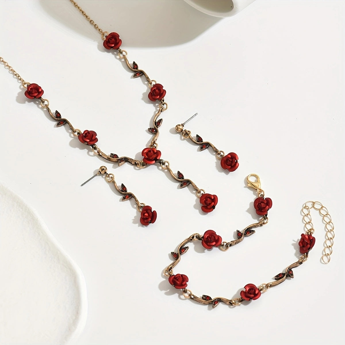 Matching red rose bracelet shown on wrist